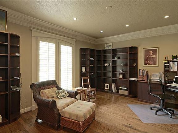  To the other side of the entry, is your "flex" room.  Need a home office?  A formal living room?  A library?  So may uses for this room!