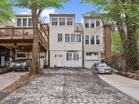 Main entry to apartment at the top of the cobblestone driveway.