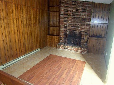 Family Room Features Great Brick Fireplace & Built-Ins 