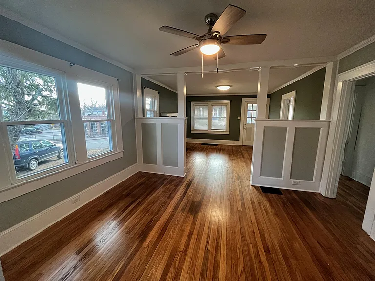 More complete view of the dining room doorway to the right leads to small hall where you can access the full bathroom and bedrooms.