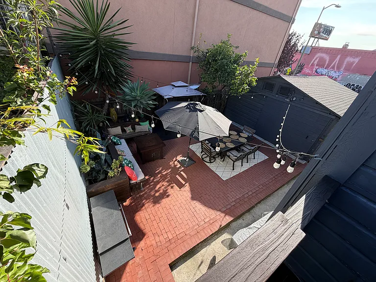 Overview from the Staircase to the Shared Backyard and Detached Garage.