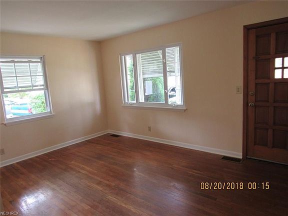 Living room is a good size offering options for furniture placement. Look at that door! BEAUTIFUL! Hardwood floors and nice natural light.