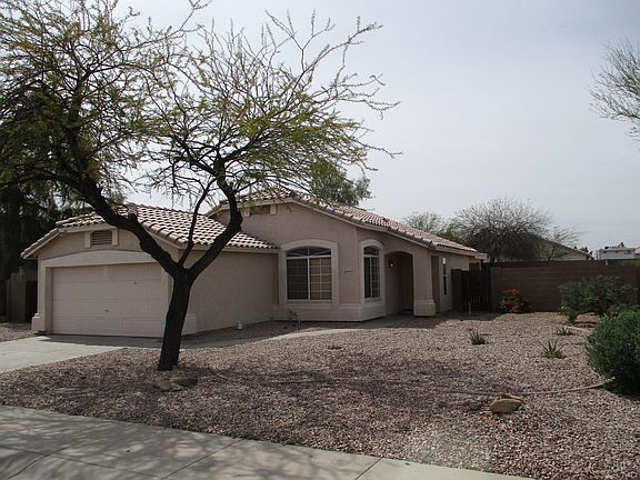 Front view - west side. Low maintenance desert landscaping.
