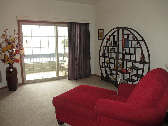 Spacious living room with ceiling fan