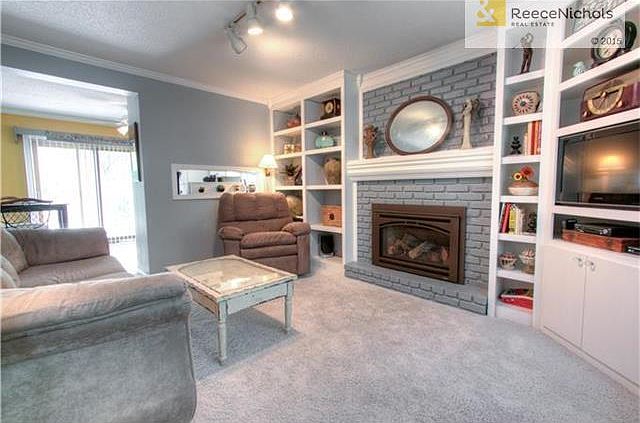 Wow, wow, wow, look at this living room!  New gas insert in the fireplace!  Built ins!