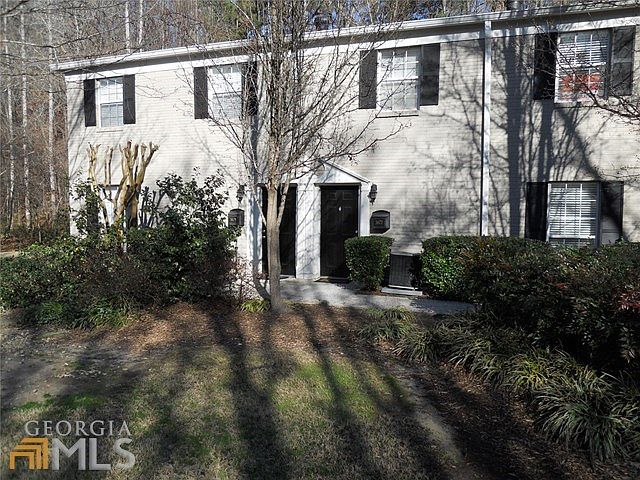 Beautiful trees and flowering bushes surround this unit.