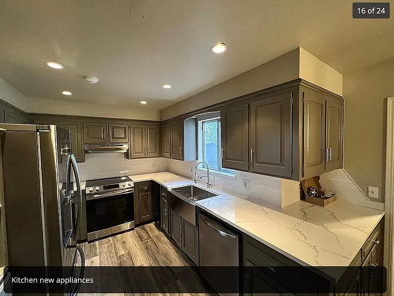 renovated kitchen with stainless steel appliances including wine fridge