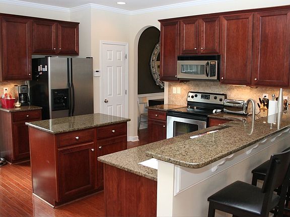 Kitchen with Island, Peninsula and granite countertops