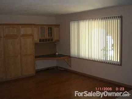 Front Room w/ Oak Cabinets & Desk
						:
						Custom built-in Desk for your computer. Oak Cabinets add extra storage.