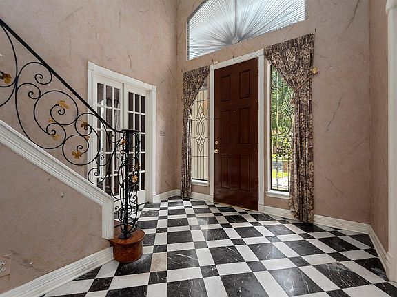 Foyer with french doors into the Dining Room.