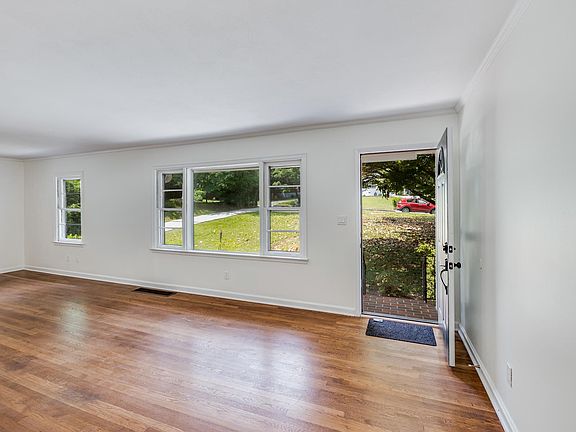 Front entrance into living room. All original wood floors and windows fully restored. All new and restored doors with new hardware.
Central HVAC System controlled with Nest thermostat.