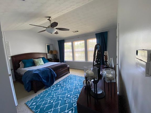 The large master bedroom can accommodate California king bed (as pictured) with room left to enjoy your living space. The master bedroom has a reading nook, walk-in closet supplement closet, and large master bath with separate shower and tub.