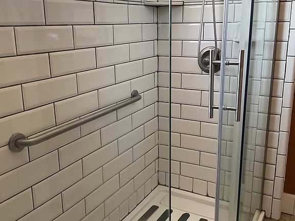 Walk- in shower with unlimited hot water & window. Also quiet exhaust fan