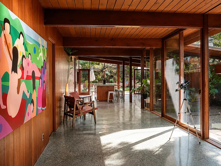 Gallery hall with original terrazzo and sightlines through walls of glass to the garden - A Quincy Jones 1951