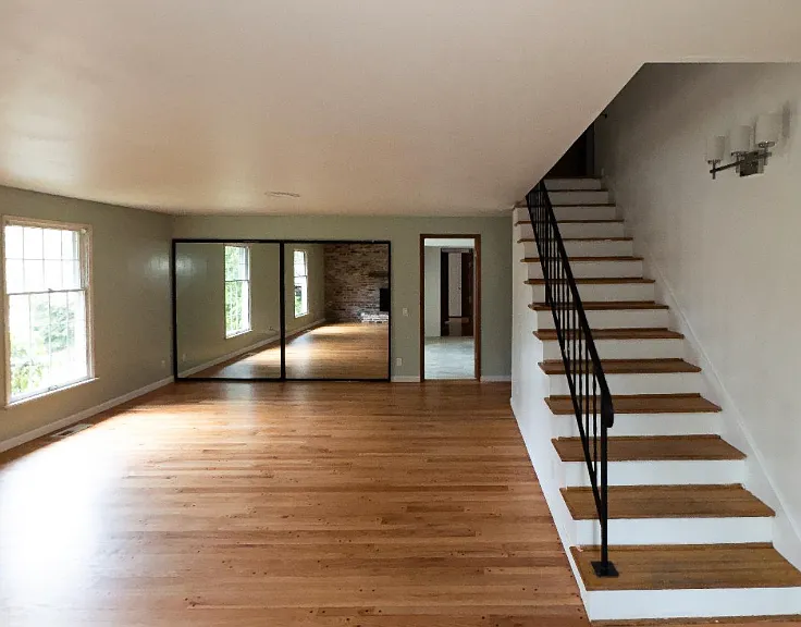 very large family room and second stairs to the second floor