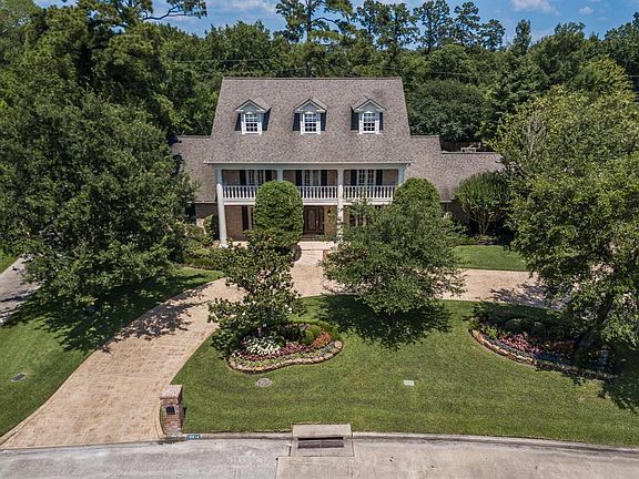 This colonial home with front porch and second level balcony is very impressive. Home is located on a double lot backing to a private reserve.