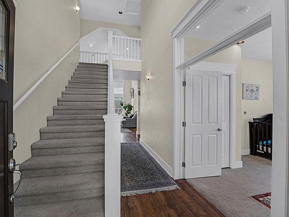 House entrance to beautiful hallway and stairs