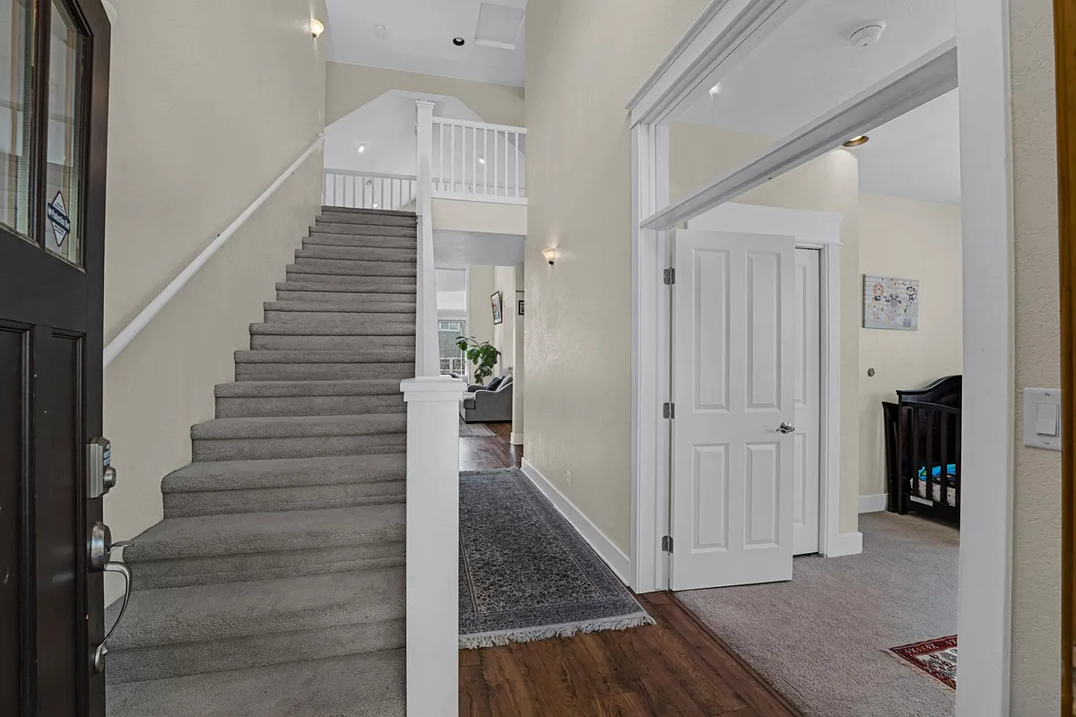 House entrance to beautiful hallway and stairs - 4987 S Serpentine Rd