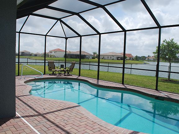 large pool with large fenced in yard
