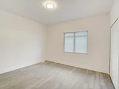 Primary suite has 9 ft ceiling luxury plank floors 2" blinds, 2 closets, 7 ft vanity with 2 sinks and knee space and a 4 foot shower with glass door and groutless walls