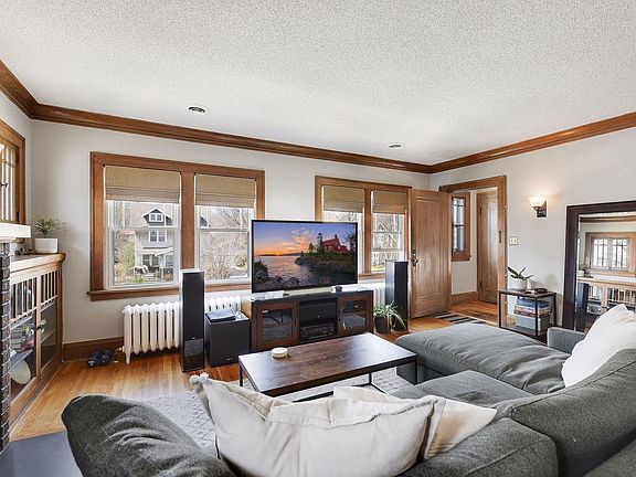 The large living room features a wood-burning fireplace, perfect for Minnesota winters.