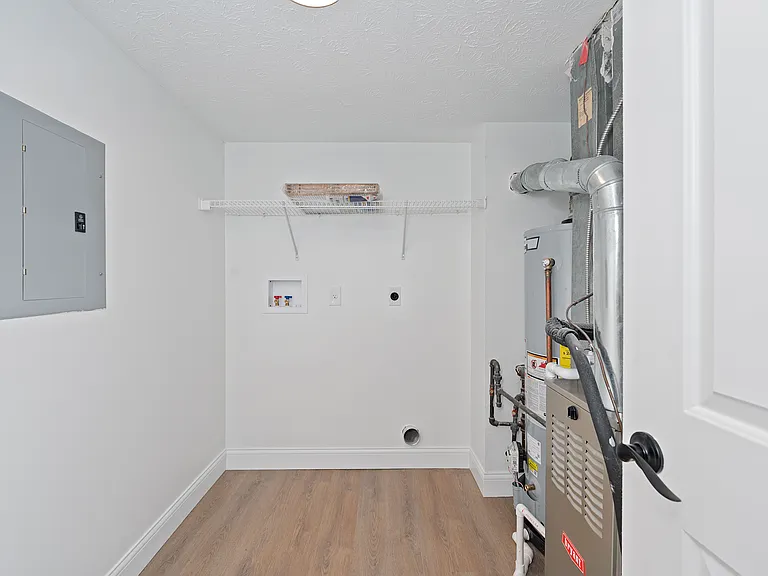 Explore the functionality of this well-organized utility room, designed for seamless utility management. Explore the functionality of this well-organized utility room, designed for seamless utility management.