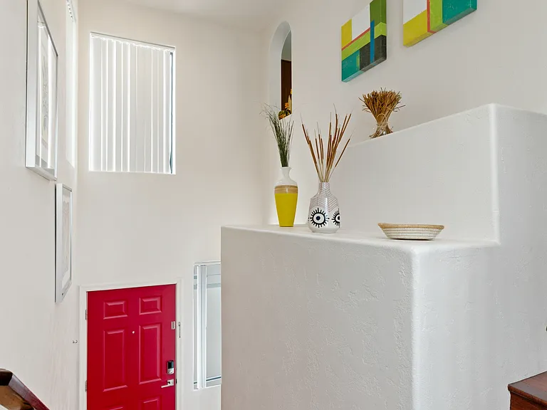 A wide, easy_to_navigate staircase leads directly from the garage to the unit.