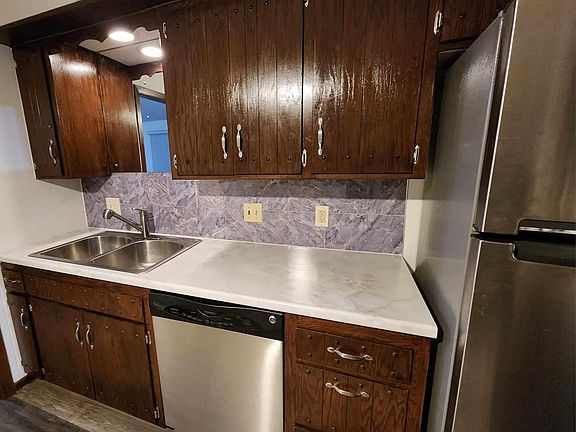 Showing deeper sink and nice faucet that pulls out and down to spray.