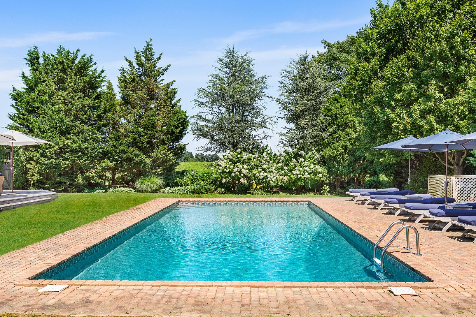  Over-sized heated pool with specimen shrubs