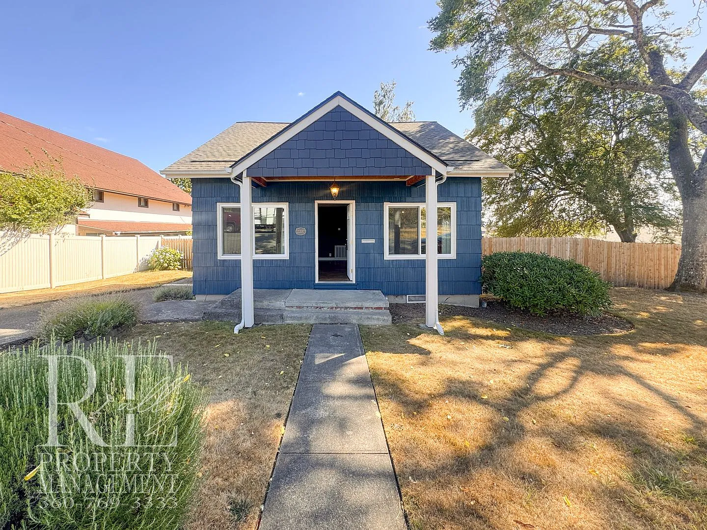 Updated 3-Bedroom Home with Fireplace, Covered Deck & Large Garage — Photo 2