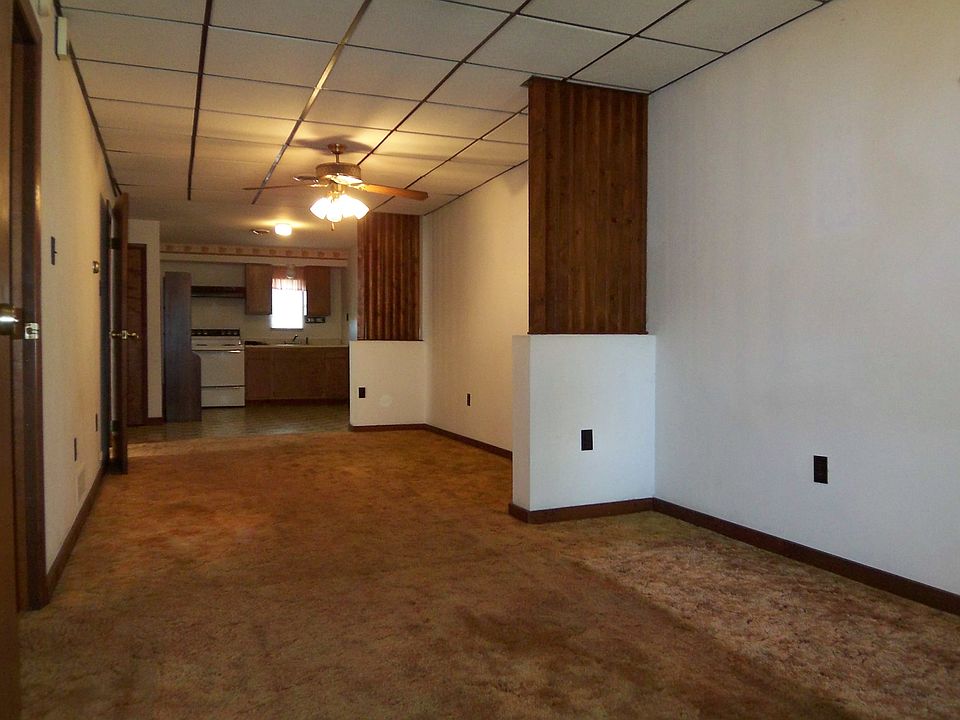 An open floor plan includes the living, dining rooms and the kitchen.