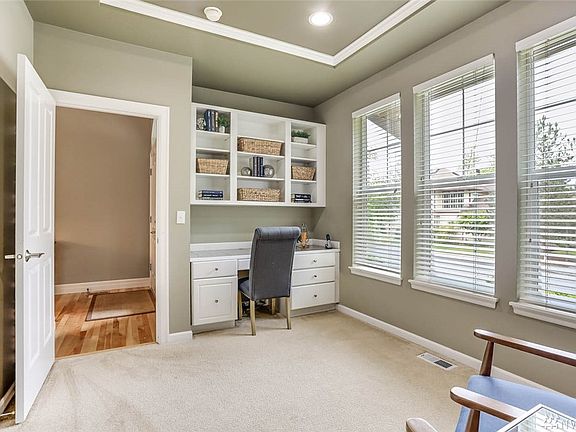 Still in the den off the entrance you'll find a built-in desk and bookshelves for all your work needs. The perfect office for peace and quiet!