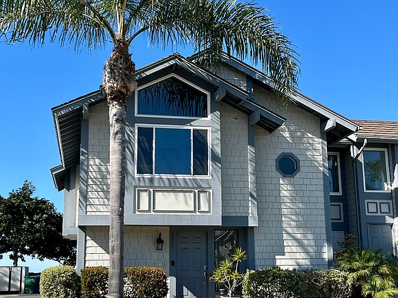 Front of condo. Enter below, and walk up stairs to all rooms on upper level. Beautiful views from upstairs, with a spacious balcony for unparalleled sunset views.