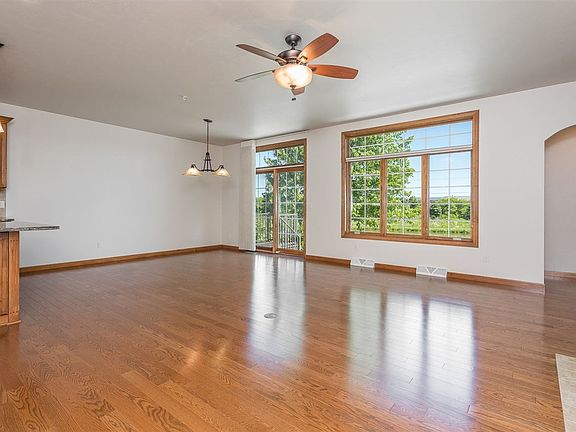 Living Room open to Dining Room with Pond Views