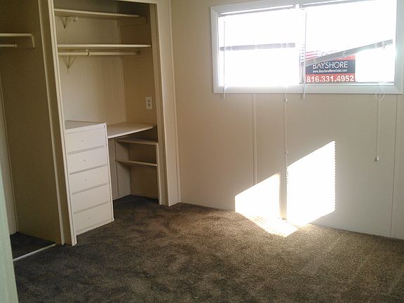Master Bedroom with Built In Desk and Closet Shelves