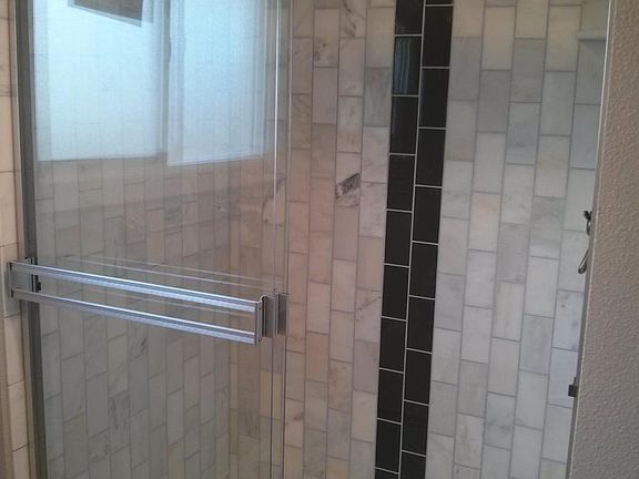 Marble shower: 3/4 bath with closet laundry unit off the kitchen on the first floor.