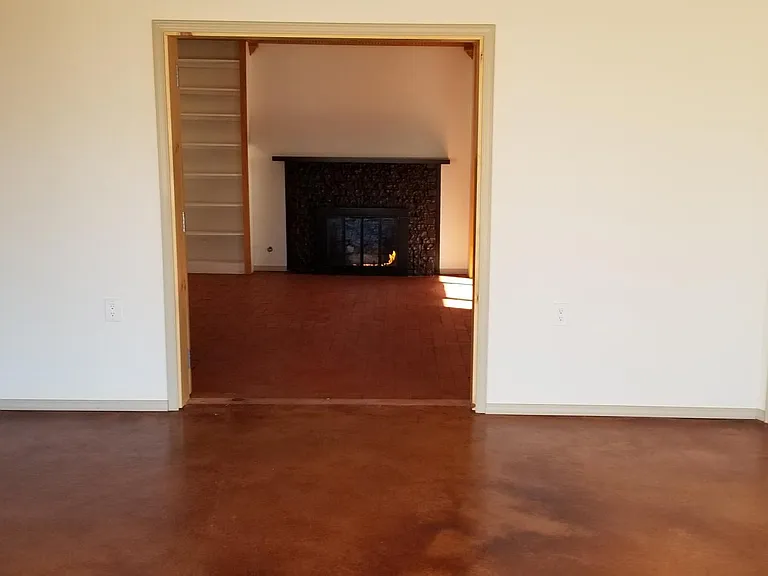 View from Living Room into Master Suite doors open (unfurnished)