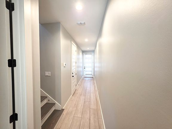 Hallway from Front Door
with Garage Door and Stairway