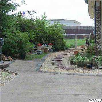 Landscaping beside carport