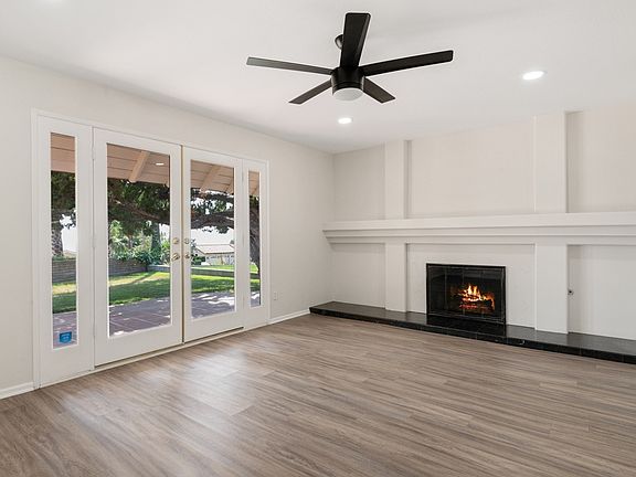 Formal Living Room with Fireplace and French Doors