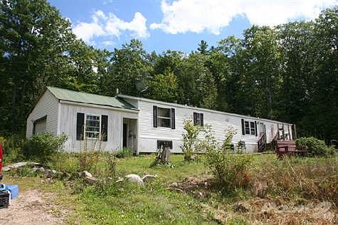 1995 Fleetwood Oakland with a 20'x 16' garage on left