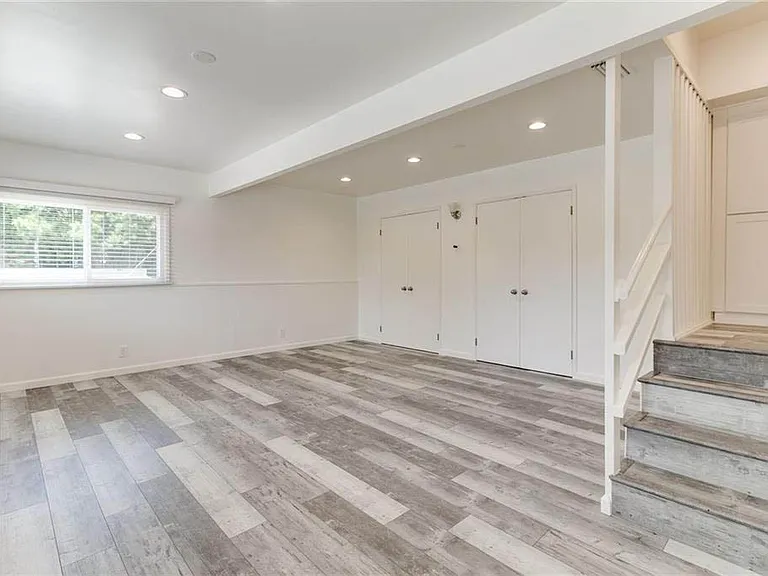Largest of the bedrooms off of the front of the home with recessed lights, luxury vinyl plank flooring, great light and large closets