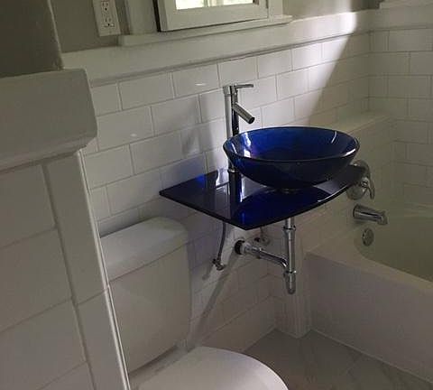 New toilet and sink. Reclaimed medicine cabinet.