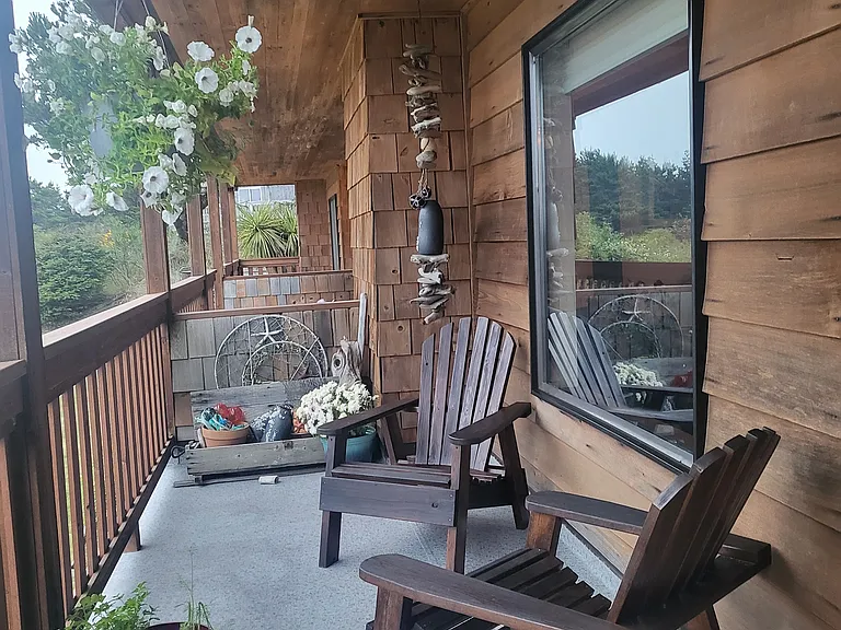 Covered back porch with tabletop bbq.
