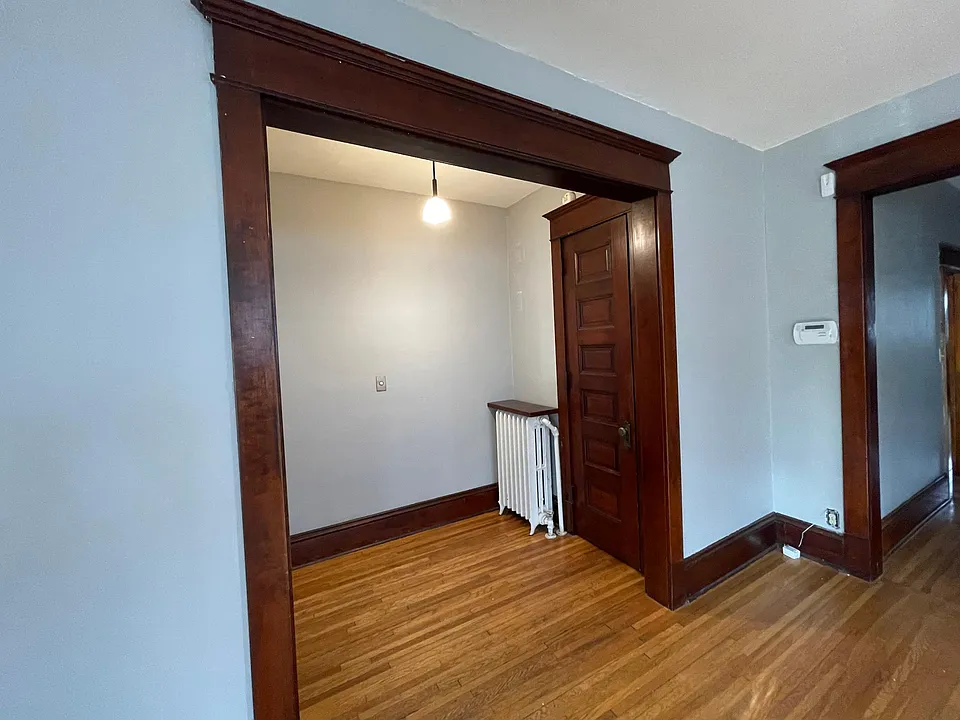 Entry with large coat closet. The paint isn't this blue.