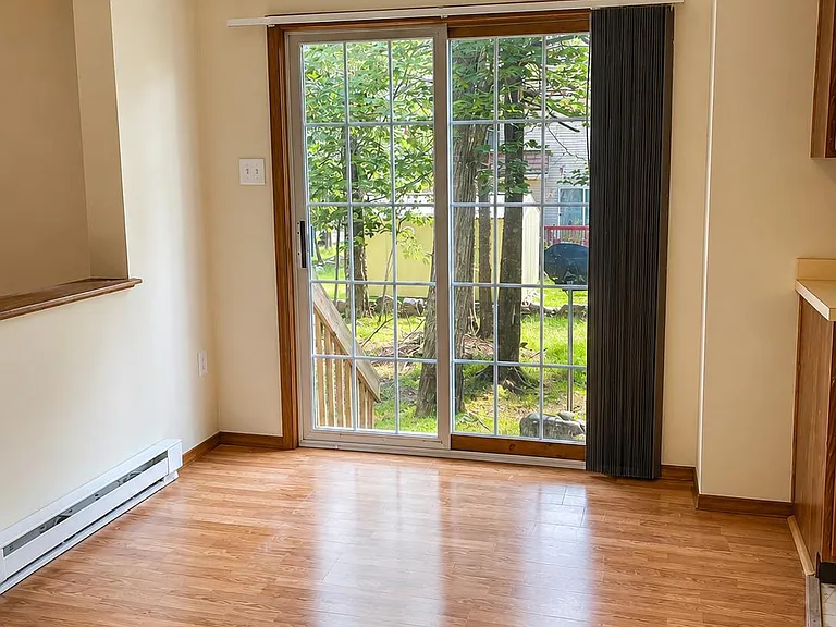 Sunny dining area with easy access to the backyard through sliding glass doors