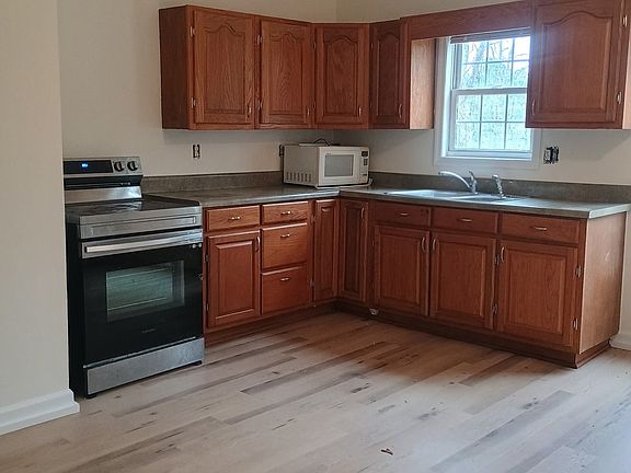 Kitchen with new flooring and paint.