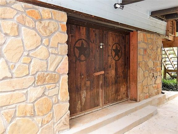This door is unique and gives the home a special charm.