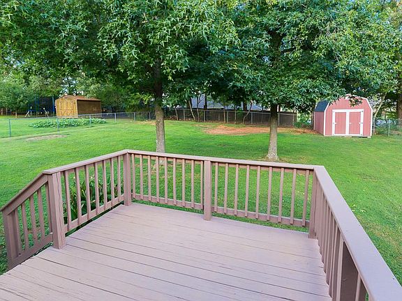 Back Porch with Wooded Landscaping and On-site Storage Unit