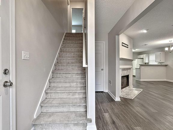 Upstairs to Two Bedrooms, Bath and Bonus Room